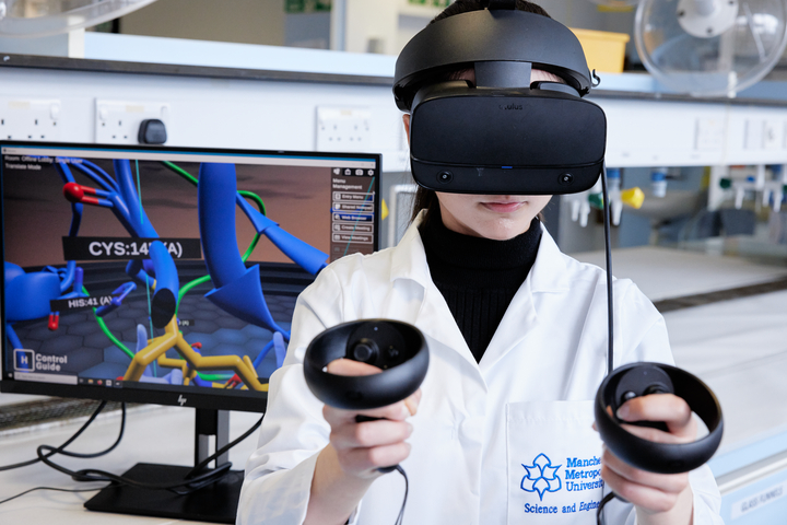 A person in a lab coat using a VR headset